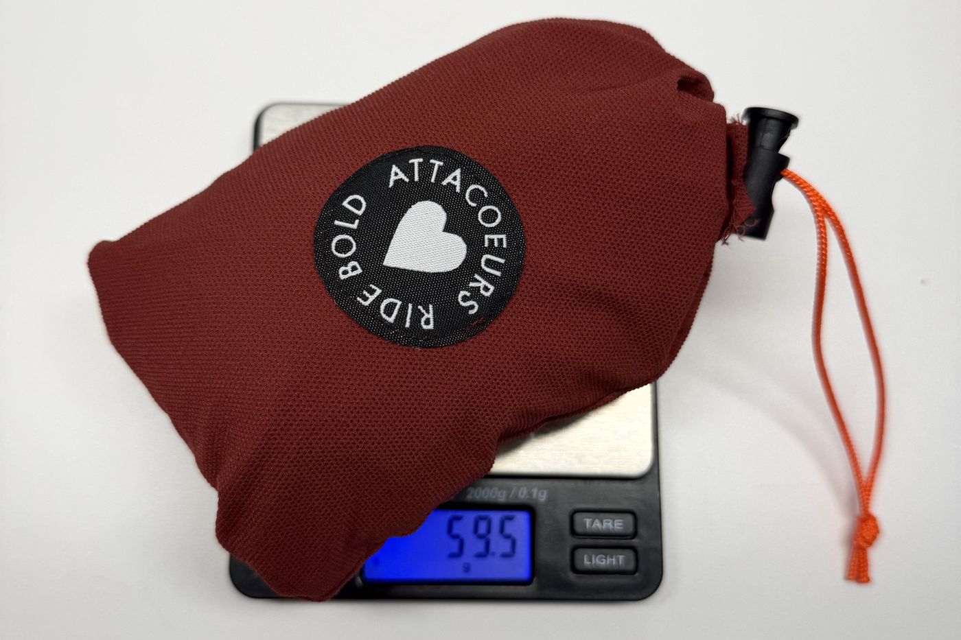 The packed musette on a digital scale reading 59.5 grams