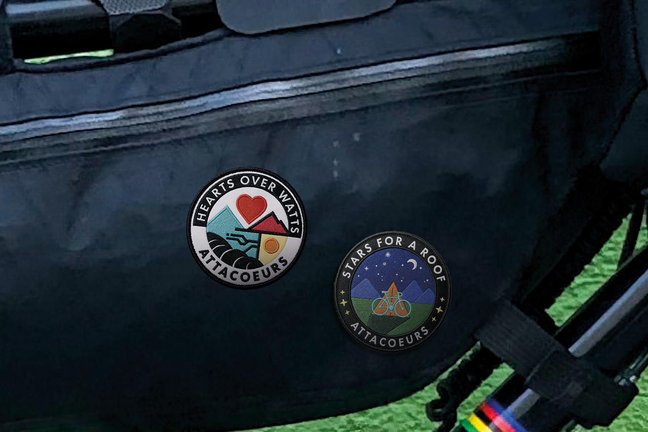 Hearts over watts and Stars for a roof patches sewn onto a bikepacking bag